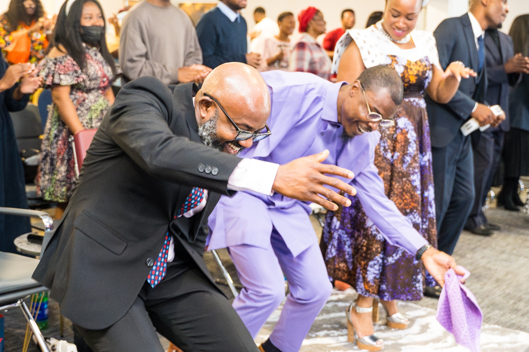 Members celebrating joyfully during worship