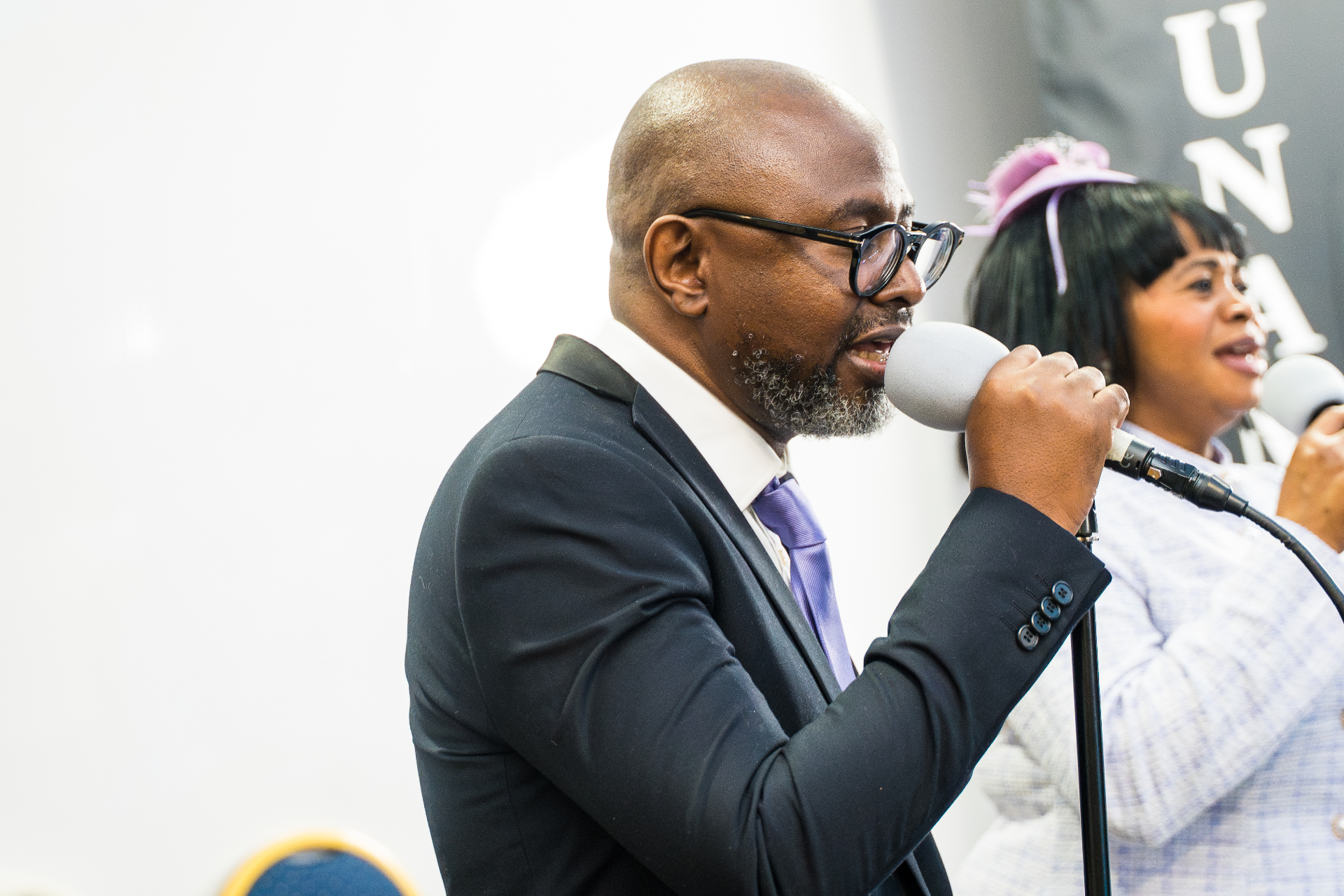 Worship leader singing into a microphone