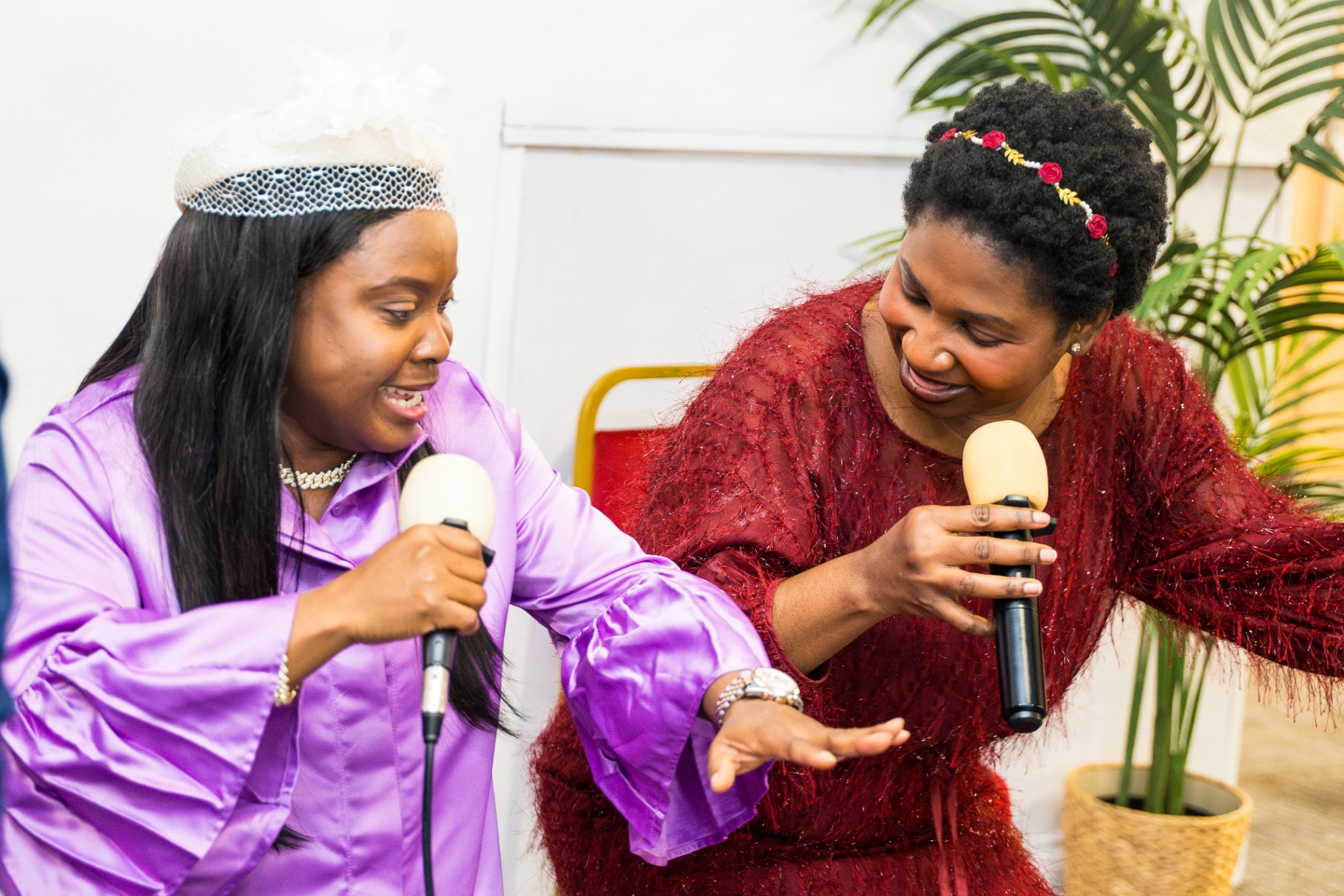 Two women ministering together with microphones during service