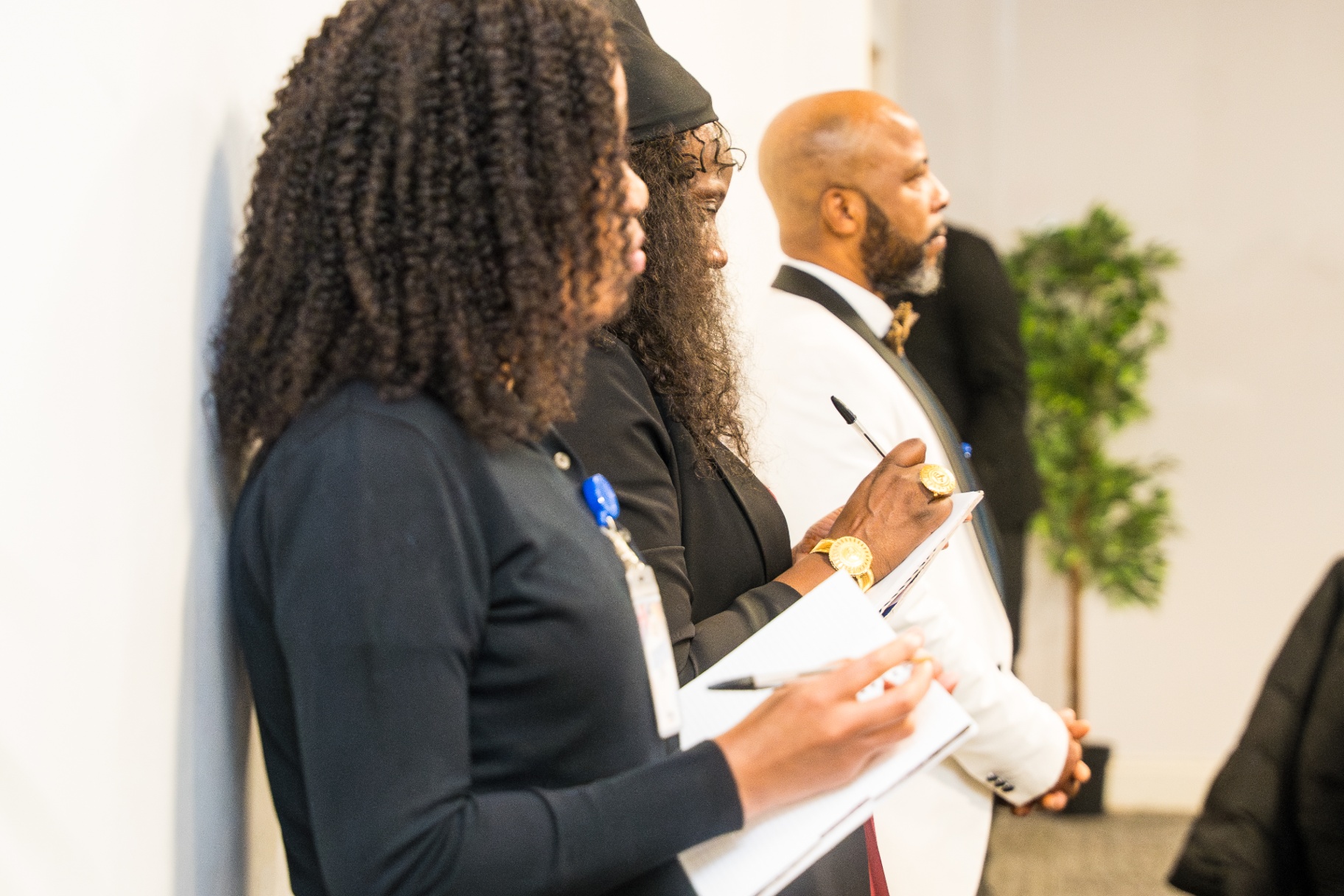 Church service team members taking notes during an event