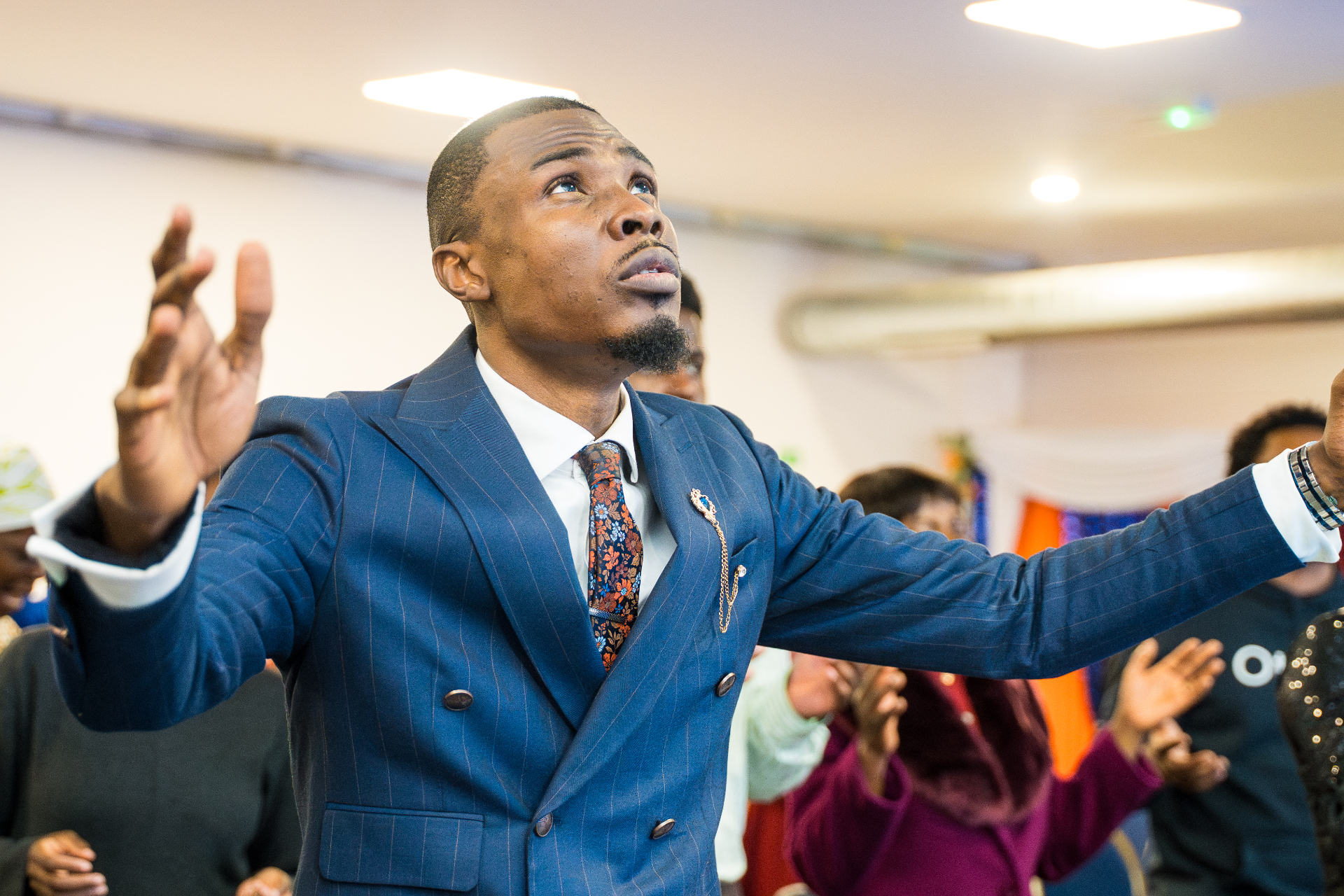 Worshipper with arms raised
