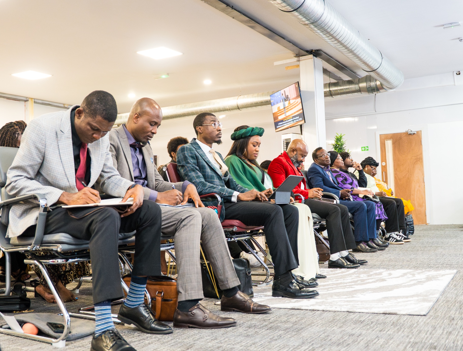 Congregation seated attentively in the front row