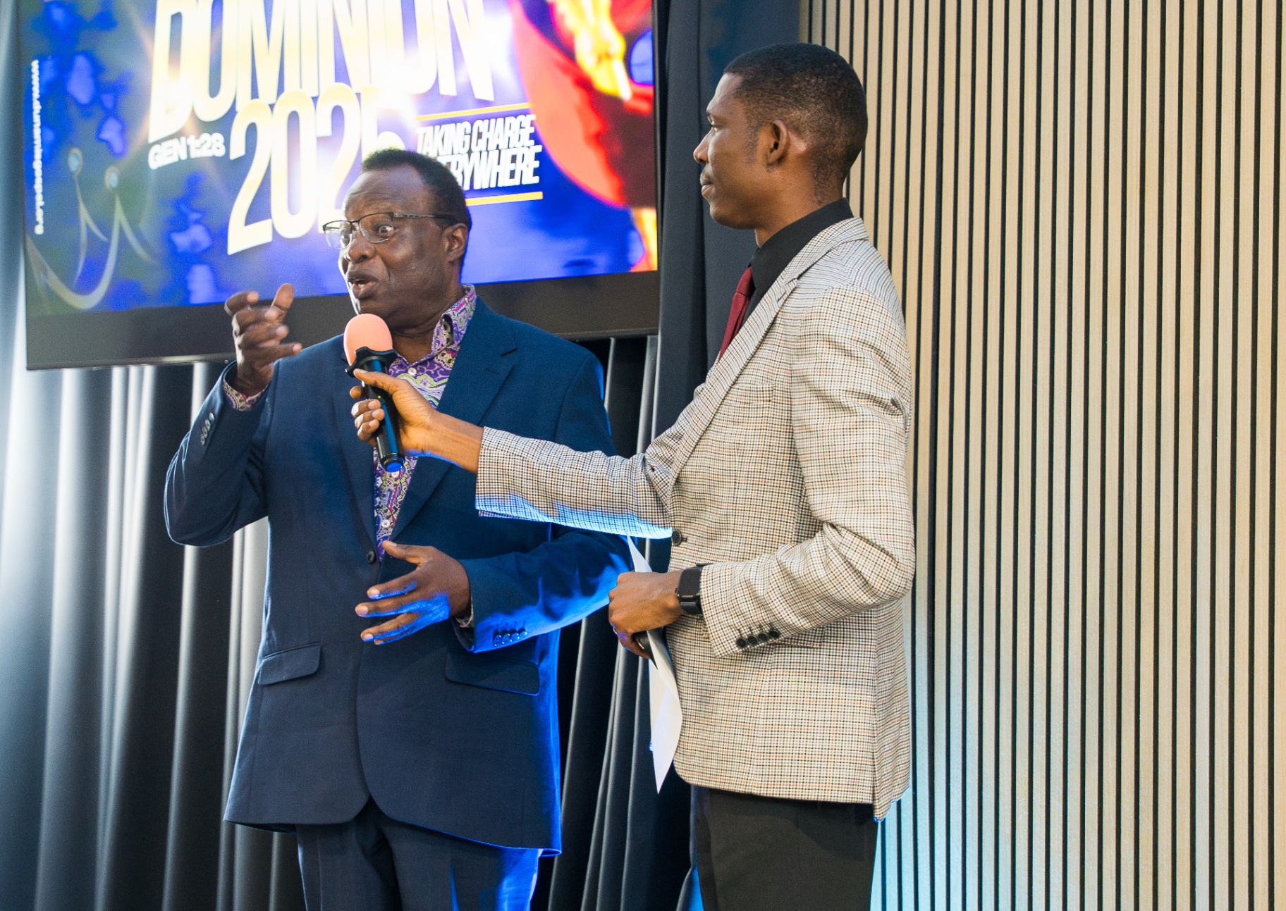Minister interviewing a guest during service